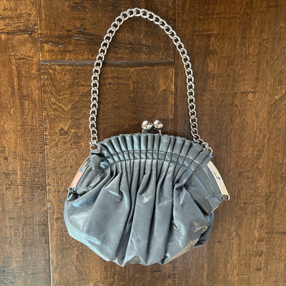 Gray faux leather evening bag with silver chain strap and kiss-lock closure